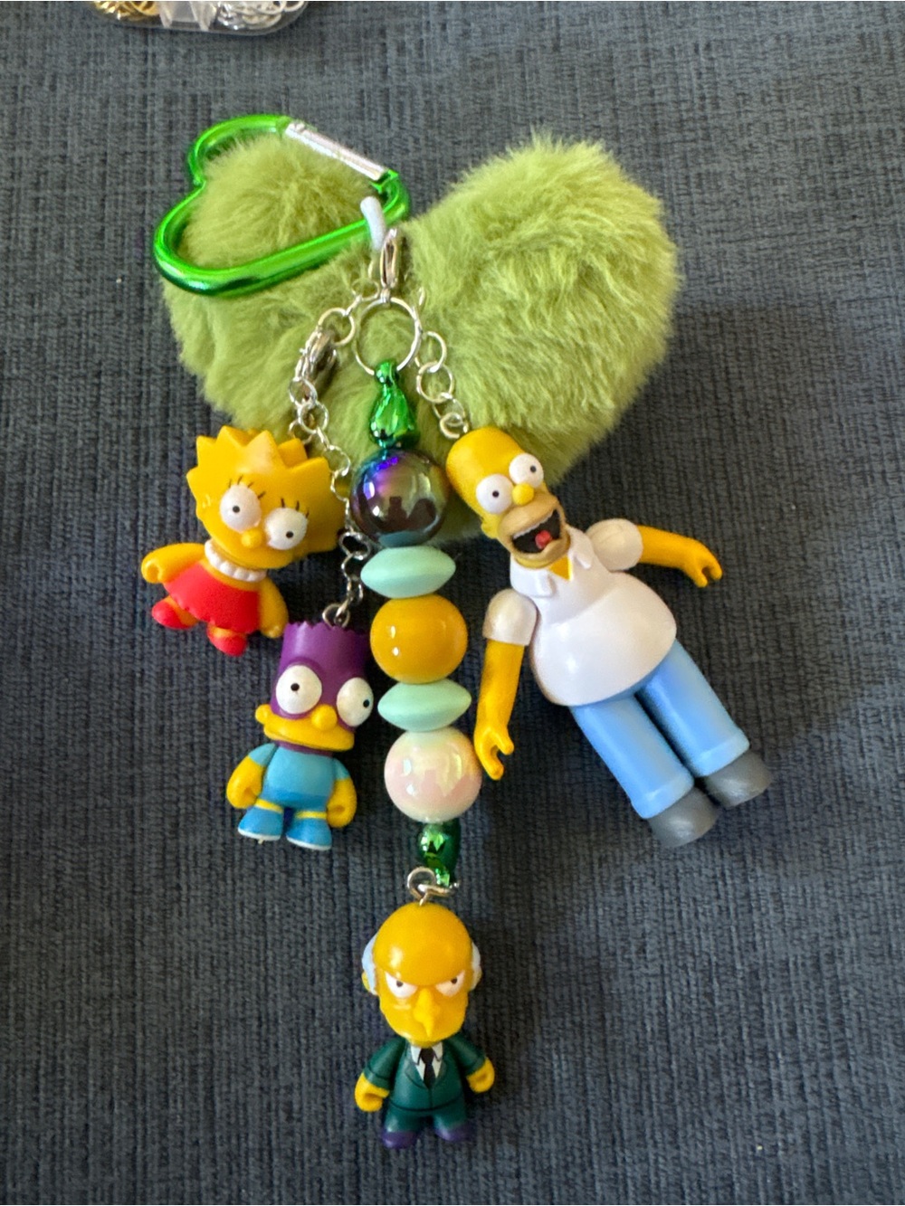 custom junk keychain 
Plush Green Heart Keychain with Yellow Character Charms